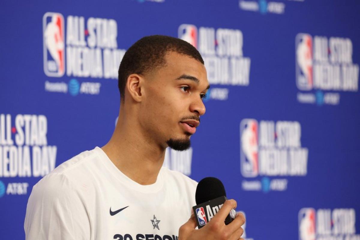 French basketball player Victor Wembanyama of the San Antonio Spurs speaks to the media during the NBA All-Star media day at the Intuit Dome in Inglewood, California, on February 14, 2026. Patrick T. Fallon / AFP