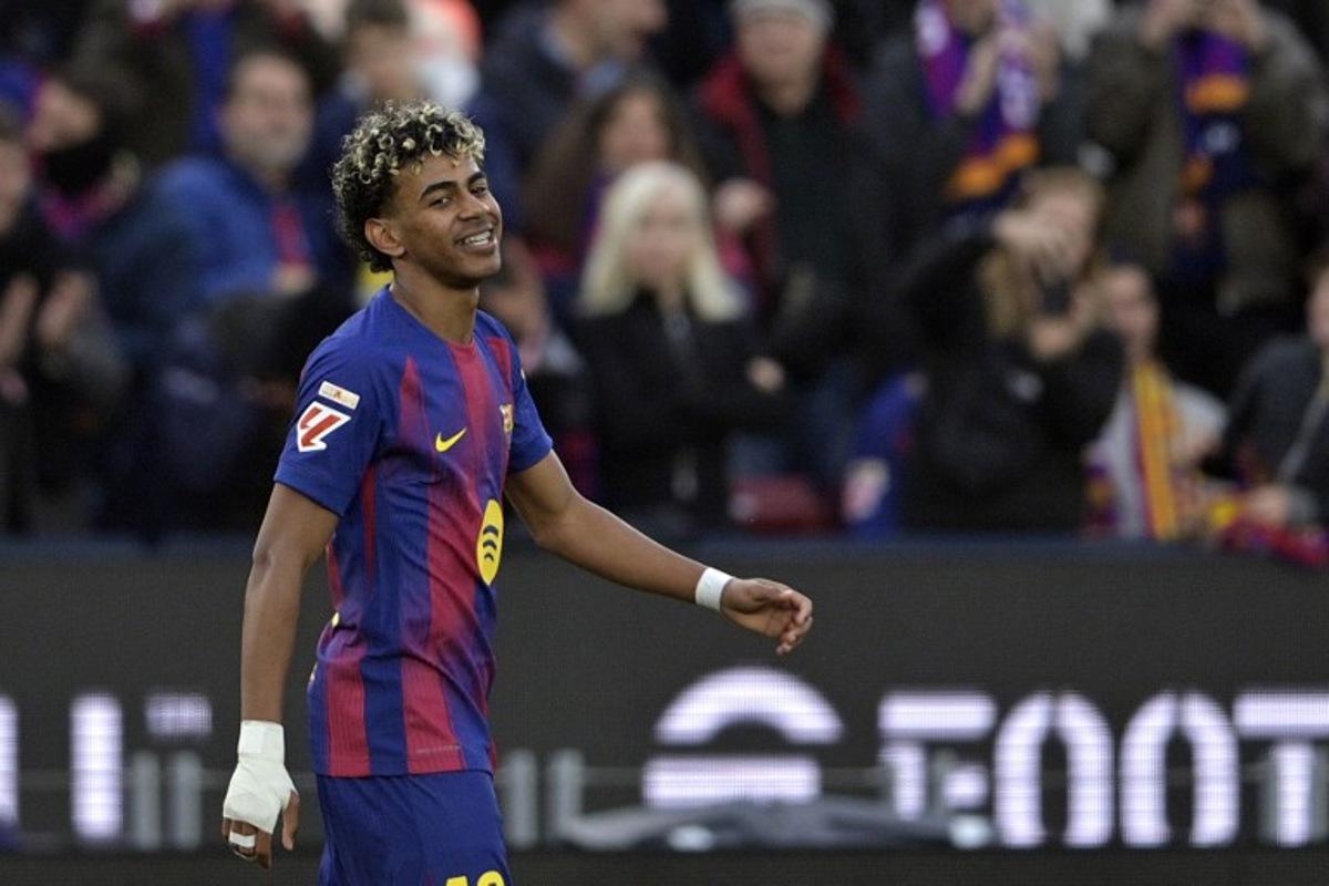 Barcelona's Spanish forward #10 Lamine Yamal celebrates scoring his third goal during the Spanish league football match between FC Barcelona and Villarreal CF at Camp Nou Stadium in Barcelona on February 28, 2026. MANAURE QUINTERO / AFP