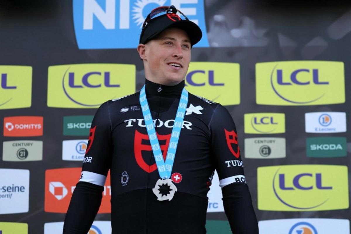 Stage winner Tudor Pro Cycling Team's Dutch cyclist Arvid De Kleijn celebrates on the podium after winning the 2nd stage of the Paris-Nice cycling race, 179 km between Thoiry and Montargis, on March 4, 2024. Thomas SAMSON / AFP