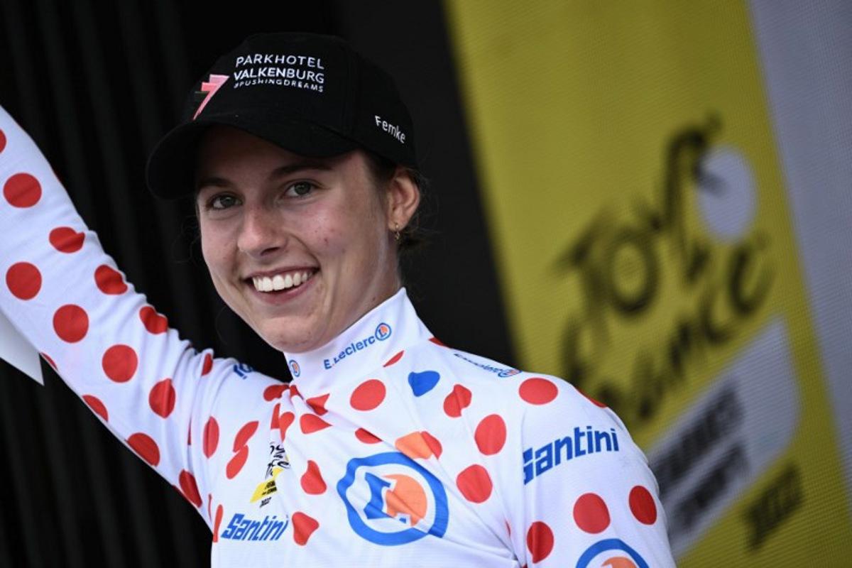 Parkhotel Valekenburg's Dutch rider Femke Gerritse celebrates her best climber's polka dot jersey on the podium at the end of the 3rd stage of the new edition of the Women's Tour de France cycling race, 133,6 km between Reims and Epernay on July 26, 2022. Jeff PACHOUD / AFP