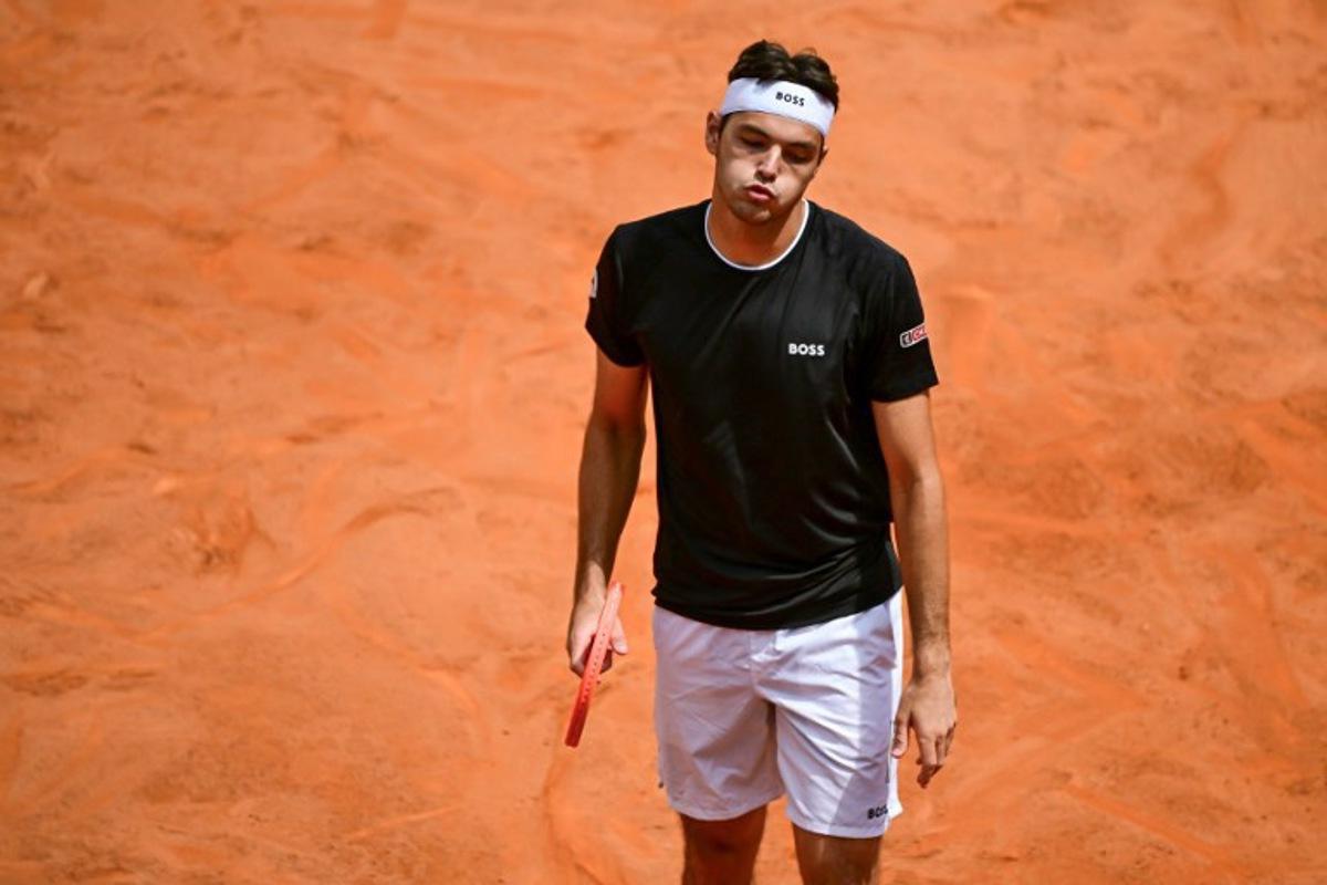 US' Taylor Fritz reacts during the men's singles match against US' Marcos Giron for the ATP Rome Open tennis tournament at Foro Italico in Rome on May 10, 2025. PIERO CRUCIATTI / AFP