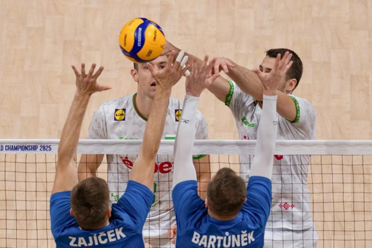 Bulgaria's Martin Atanasov (back R) spikes the ball against Czech Republic's Adam Zajicek and Lubos Bartunek during the 2025 Men's Volleyball World Championship semi-final match at the Mall of Asia Arena in Pasay City, Metro Manila on September 27, 2025. Ted ALJIBE / AFP