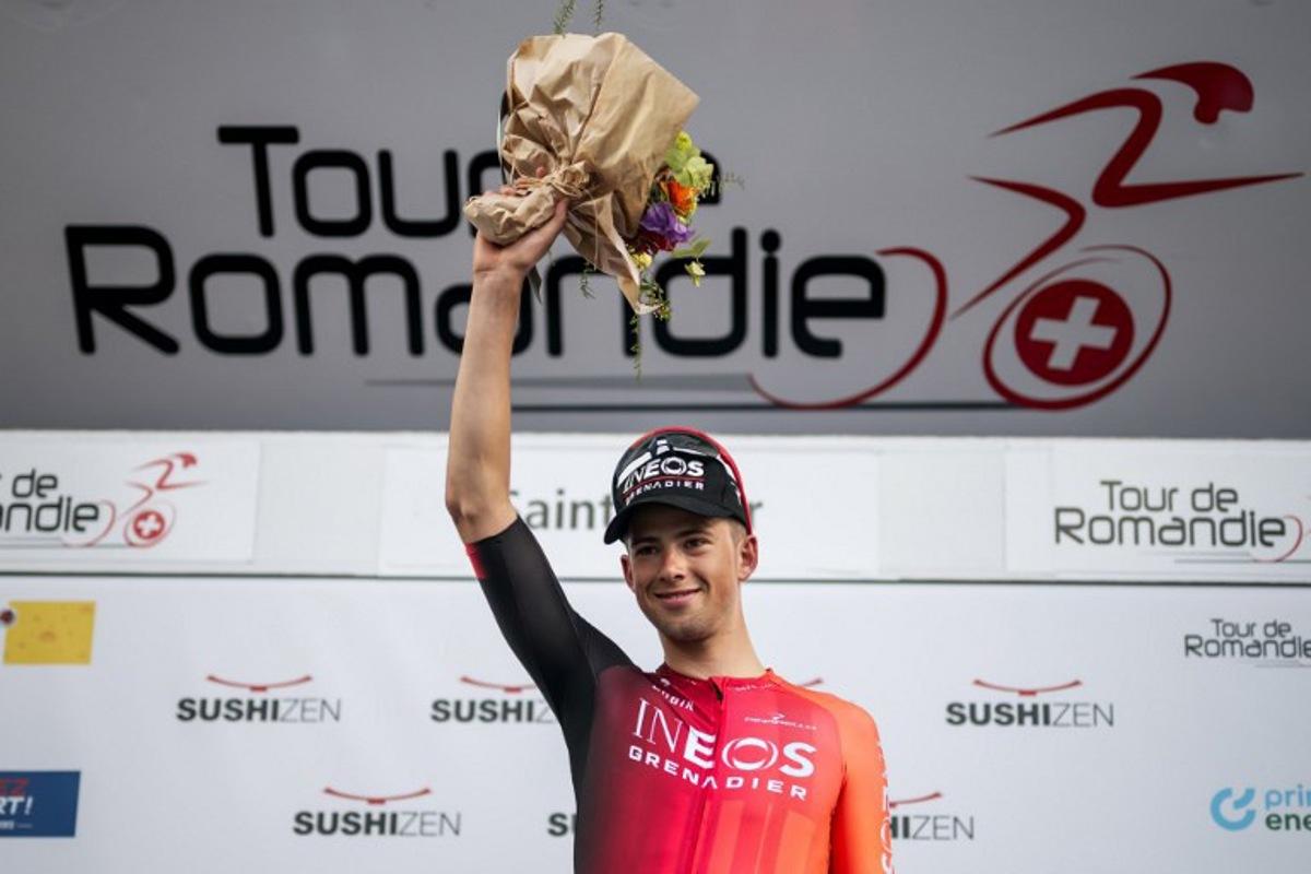 Great Britain's Samuel Watson (Ineos) celebrates his victory during the podium ceremony for the prologue of the Tour of Romandie UCI cycling World tour, a 3.4 km time trial from Saint-Imier to Saint-Imier, on April 29, 2025. Fabrice COFFRINI / AFP