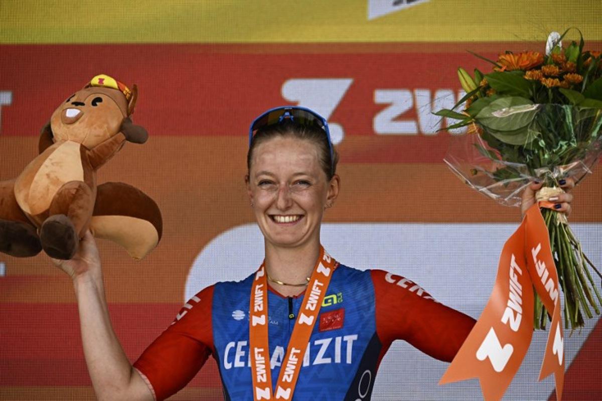 Ceratizit - WNT Pro Cycling Team's French rider Cedrine Kerbaol (C) celebrates her win on the podium after the 6th stage (out of 8) of the third edition of the Women's Tour de France cycling race, a 159.2 km between Remiremont and Morteau, eastern France, on August 16, 2024. JULIEN DE ROSA / AFP