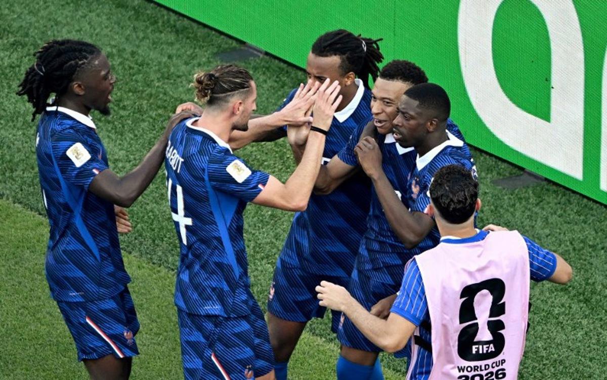 France's forward #10 Kylian Mbappe celebrates with teammates after scoring his team's first goal from the penalty spot during the 2026 World Cup round of 16 football match between Paraguay and France at the Philadelphia Stadium in Philadelphia on July 4, 2026. Jewel SAMAD / AFP