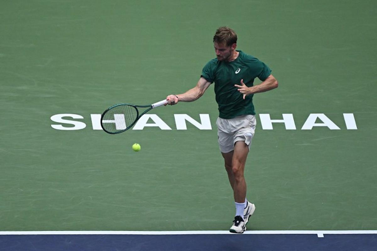 Belgium's David Goffin hits a return to USA's Ben Shelton during their men's singles match at the Shanghai Masters tennis tournament in Shanghai on October 3, 2025. Jade Gao / AFP