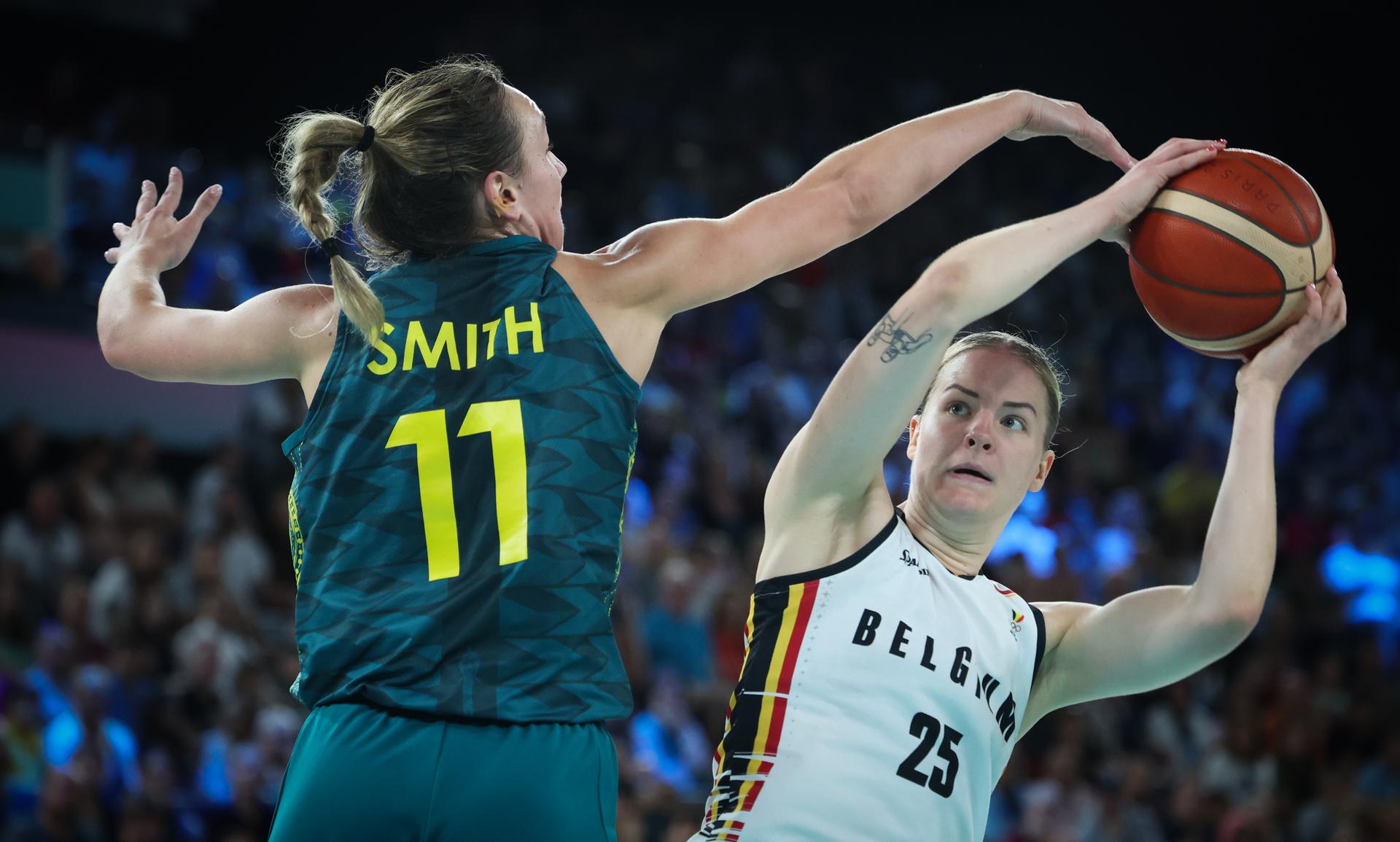 Australia's Alanna Smith and Belgium's Billie Massey fight for the ball during a basketball game between Australia and Belgian national team the Belgian Cats, the bronze medal game of the women's tournament at the Paris 2024 Olympic Games, on Sunday 11 August 2024 in Paris, France. The Games of the XXXIII Olympiad are taking place in Paris from 26 July to 11 August. The Belgian delegation counts 165 athletes competing in 21 sports. BELGA PHOTO VIRGINIE LEFOUR