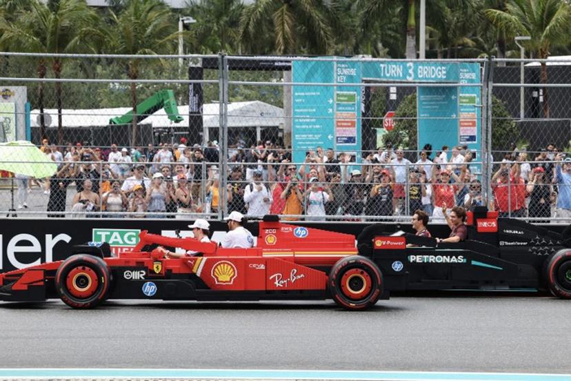 (L-R) Ferrari's Monegasque driver Charles Leclerc, Ferrari's British driver Lewis Hamilton, Mercedes' British driver George Russell and Mercedes' Italian driver Andrea Kimi Antonelli ride in Lego cars during the Driver's Parade before the 2025 Miami Formula One Grand Prix at Miami International Autodrome in Miami Gardens, Florida, on May 4, 2025. CHARLY TRIBALLEAU / AFP