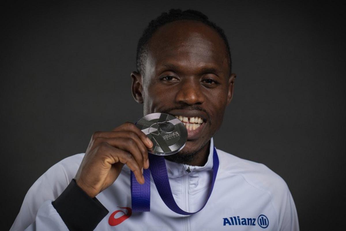 Silver medallist in the men's 5000m event Belgium's athlete Isaac Kimeli poses for portraits during a studio photo session on the sidelines of the World Athletics Championships in Tokyo on September 21, 2025. Andrej ISAKOVIC / AFP