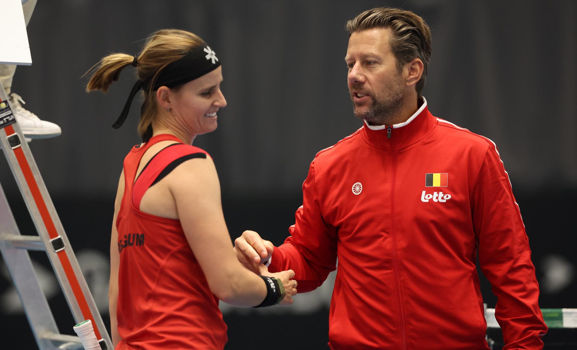 Belgian Greet Minnen and Belgian team captain Wim Fissette celebrate after winning a tennis match between Belgian Minnen and Hungarian Bondar, in the meeting between Belgium and Hungary in the pool phase of the Europe/Africa Group I of the Billie Jean King Cup tennis, in Vilnius, Lithuania on Wednesday 09 April 2025. PHOTO VIRGINIE LEFOUR