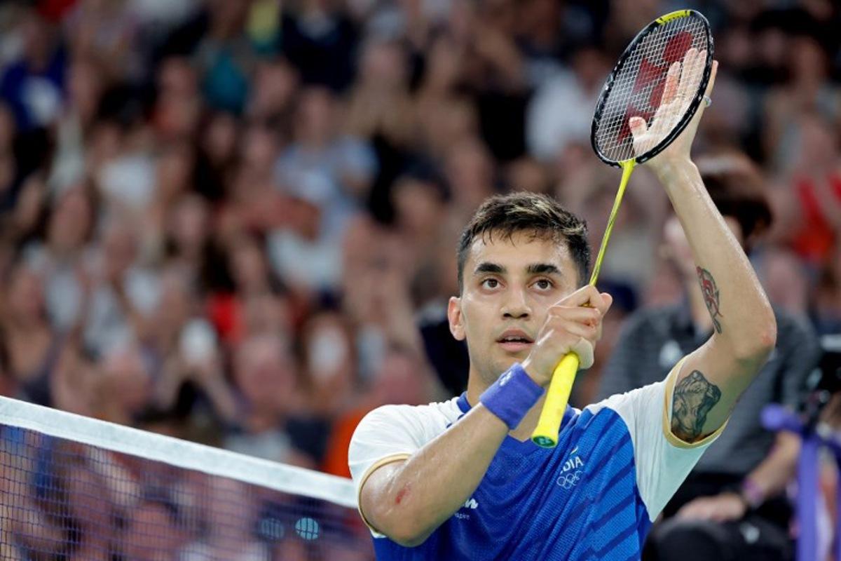 India's Lakshya Sen celebrates his win against Belgium's Julien Carraggi in their men's singles badminton group stage match during the Paris 2024 Olympic Games at Porte de la Chapelle Arena in Paris on July 29, 2024. David GRAY / AFP