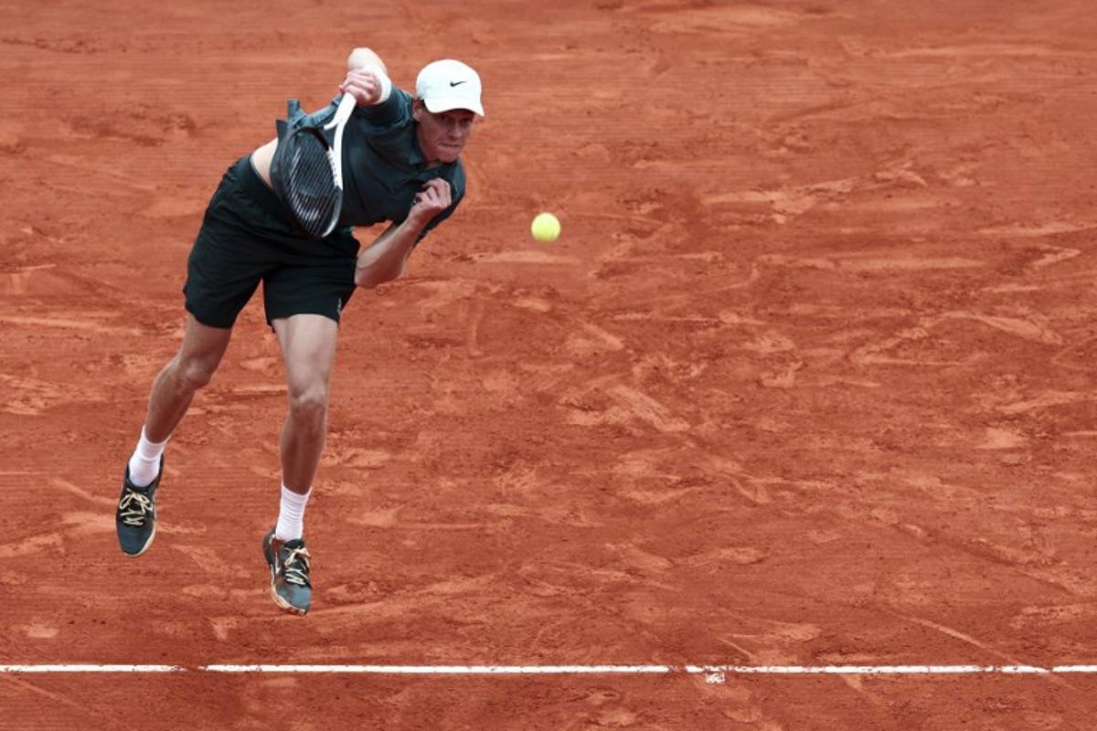 Italy's Jannik Sinner plays a backhand return to Germany's Alexander Zverev during the Monte Carlo ATP Masters Series Tournament semi-final tennis match on Court Rainier III at the Monte-Carlo Country Club in Roquebrune-Cap-Martin, south-eastern France on April 11, 2026. Thibaud MORITZ / AFP