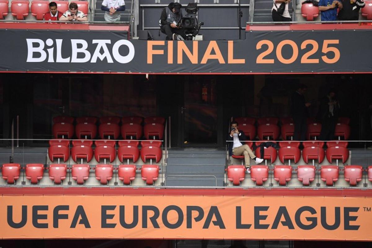 Some early fans take their seats prior to the UEFA Europa League final football match between Tottenham Hotspur and some early Utd fans at San Mames stadium in Bilbao on May 21, 2025. ANDER GILLENEA / AFP