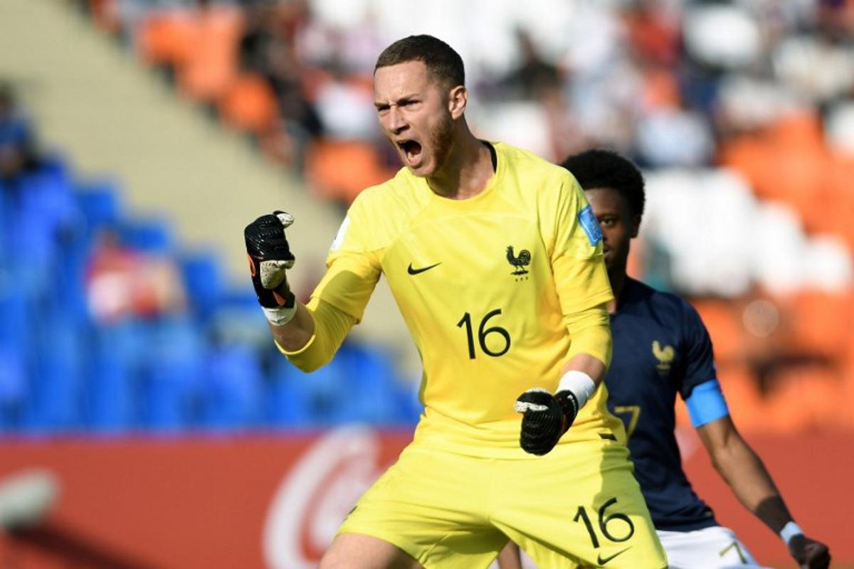 France's goalkeeper Yann François Lienard celebrates after saving a penalty during the Argentina 2023 U-20 World Cup Group F football match between France and Gambia at the Malvinas Argentinas stadium in Mendoza, Argentina, on May 25, 2023. Andres Larrovere / AFP