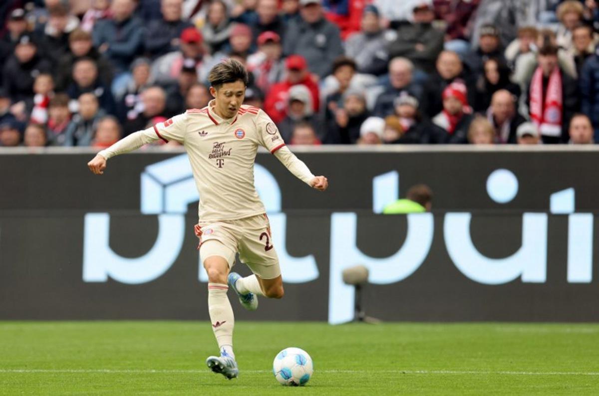 Bayern Munich's Japanese defender #21 Hiroki Ito plays the ball during the German first division Bundesliga football match between FC Bayern Munich and St Pauli in Munich, southern Germany on March 29, 2025. Alexandra BEIER / AFP