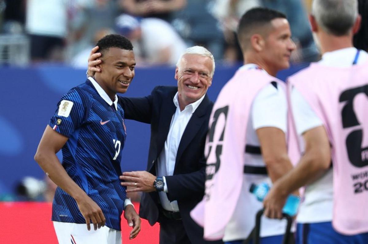 France's head coach Didier Deschamps congratulates his forward #10 Kylian Mbappe after scoring his team's first goal during the 2026 World Cup Group I football match between France and Senegal at the New York/New Jersey Stadium in East Rutherford on June 16, 2026. FRANCK FIFE / AFP