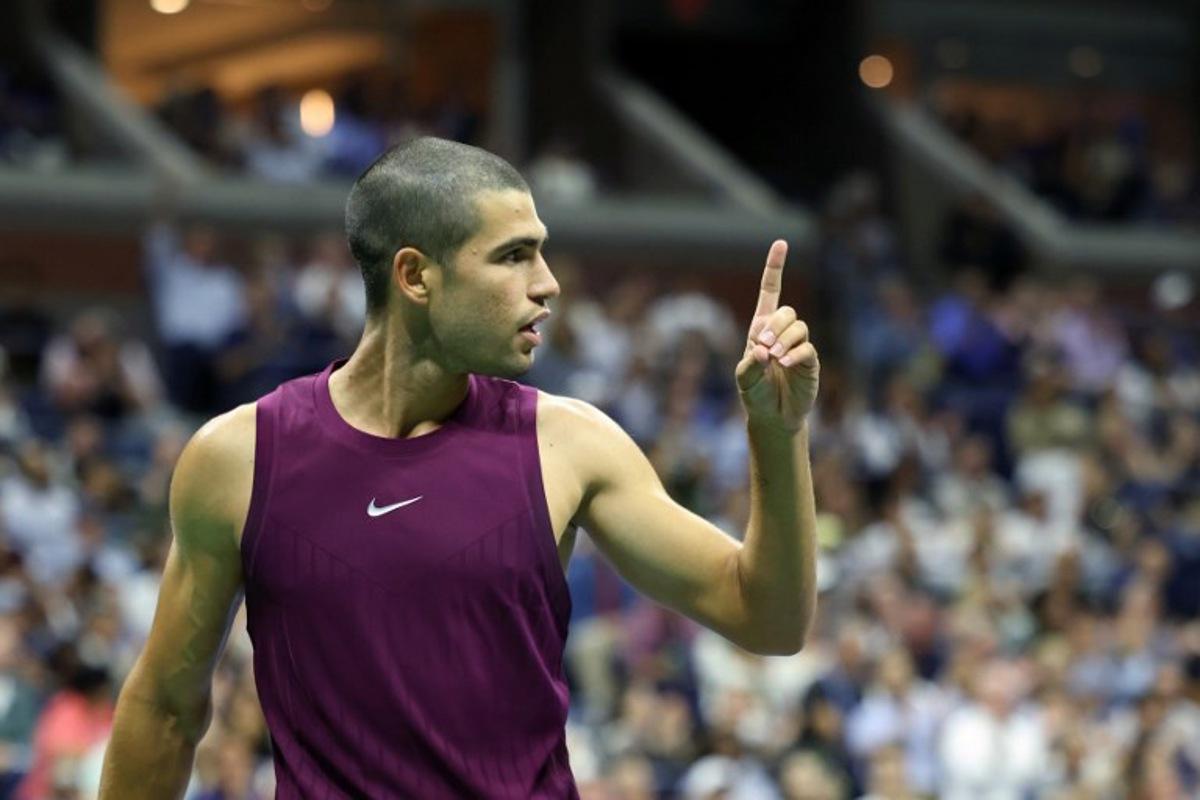 Spain's Carlos Alcaraz gestures after a point won against Italy's Mattia Bellucci during their men's singles second round tennis match on day four of the US Open tennis tournament at the USTA Billie Jean King National Tennis Center in New York City, on August 27, 2025. CHARLY TRIBALLEAU / AFP