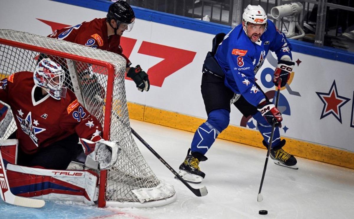 NHL's Russian Alexander Ovechkin (R) attacks the net of KHL's Daniil Isayev during the charity hockey "Match of the Year" between Russian players of the National Hockey League (NHL) and the Kontinental Hockey League (KHL) at the CSKA arena in Moscow on July 13, 2025. Alexander NEMENOV / AFP