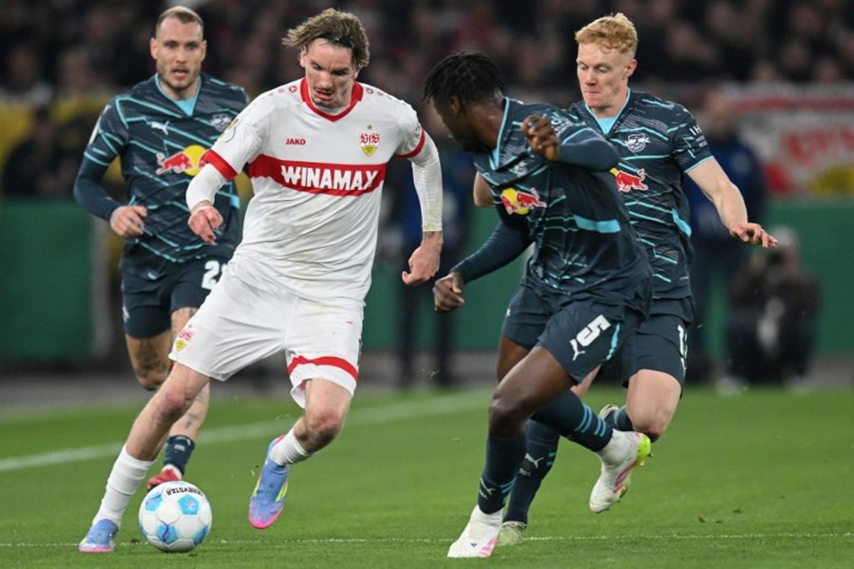 Stuttgart's German forward #11 Nick Woltemade (L) and Leipzig's French defender #05 El Chadaille Bitshiabu vie for the ball during the German Cup (DFB Pokal) semi-final football match between VfB Stuttgart and RB Leipzig in Stuttgart, southwestern Germany on April 2, 2025. THOMAS KIENZLE / AFP