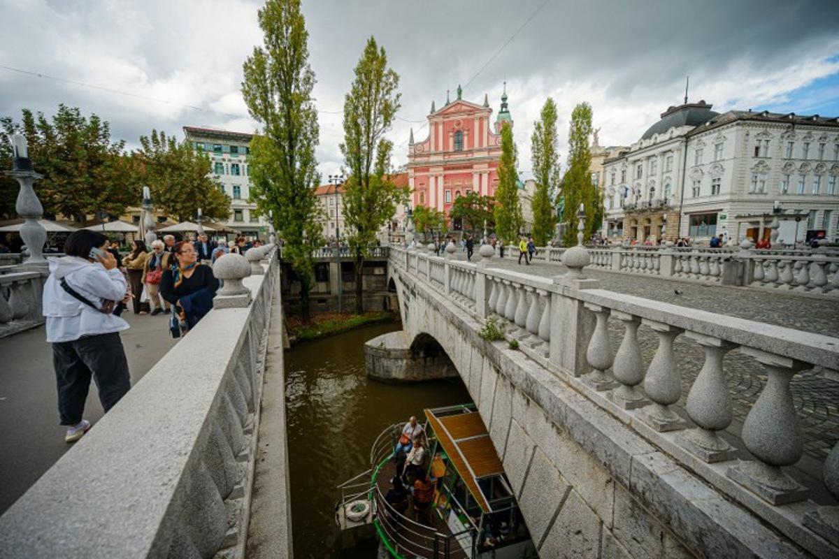 This potograph shows a general view of the Ljubljana city centre with the Three Bridges, Preseren Square and Ljubljanica river, in Ljubljana on September 26, 2025. Jure Makovec / AFP