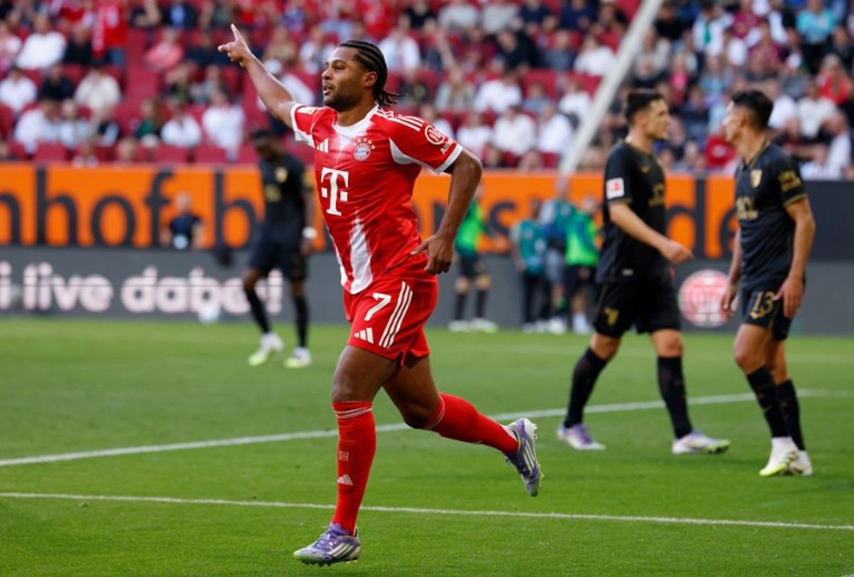 Bayern Munich's German forward #07 Serge Gnabry celebrates scoring the opening goal during the German first division Bundesliga football match between FC Augsburg and FC Bayern Munich in Augsburg, southern Germany, on August 30, 2025. Michaela STACHE / AFP