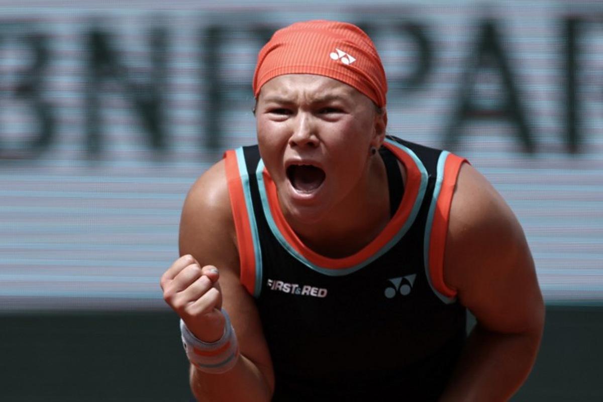 Diana Shnaider reacts to a point against US Madison Keys during their women's singles match on day 9 of the French Open tennis tournament on Court Suzanne-Lenglen at the Roland-Garros Complex in Paris on June 1, 2026. Anne-Christine POUJOULAT / AFP