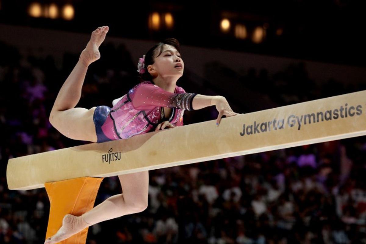 Japan's Aiko Sugihara competes during the women's balance beam final at the 53rd FIG Artistic Gymnastics World Championships in Jakarta on October 25, 2025. YASUYOSHI CHIBA / AFP