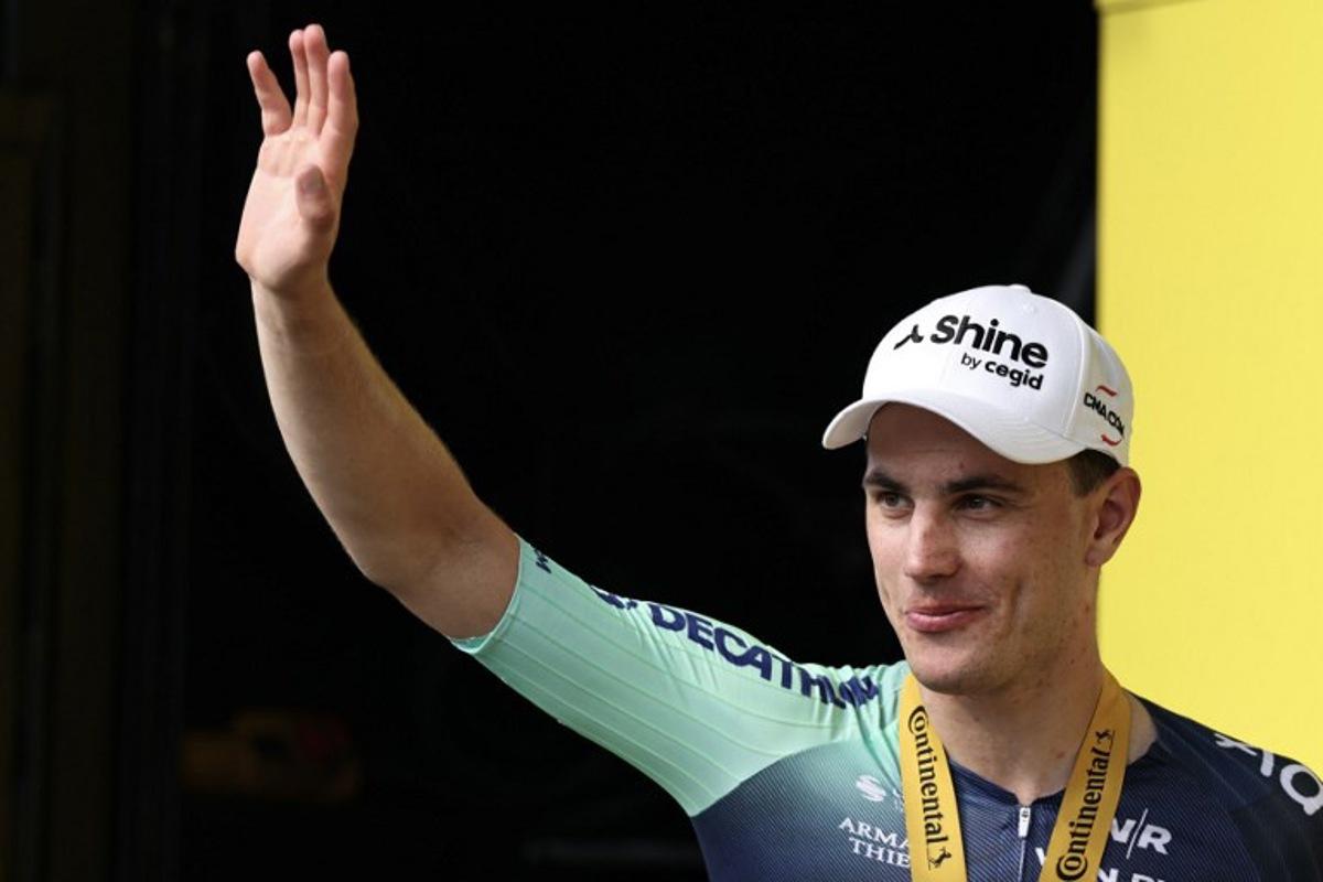 Decathlon CMA CGM Team's Dutch rider Olav Kooij celebrates on the podium after winning the 5th stage of the 113th edition of the Tour de France cycling race, 158 km between Lannemezan and Pau in southwestern France, on July 8, 2026. Anne-Christine POUJOULAT / AFP