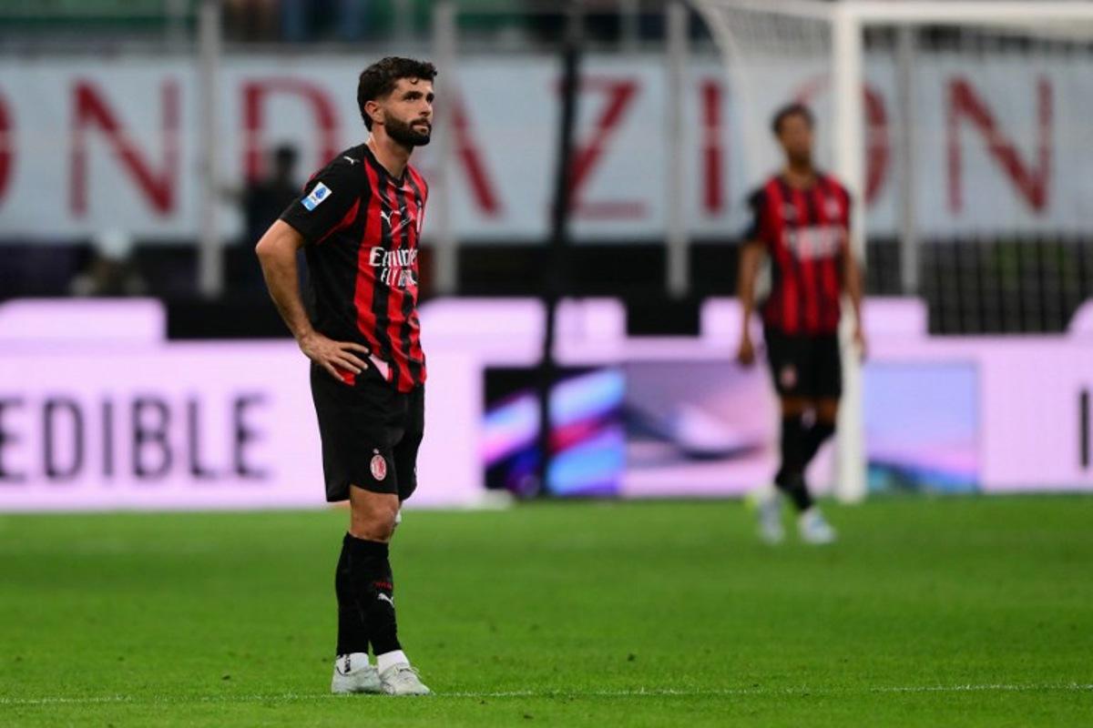 AC Milan's US midfielder #11 Christian Pulisic reacts during the Italian Serie A football match between AC Milan and Udinese at the San Siro stadium in Milan, northern Italy, on April 11, 2026. MARCO BERTORELLO / AFP