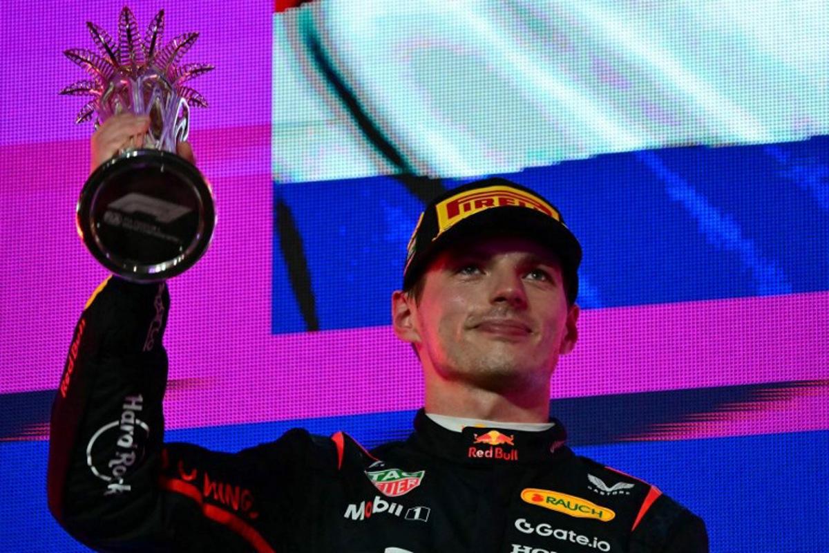 Second-placed Red Bull Racing's Dutch driver Max Verstappen lifts his trophy during podium celebrations following the 2025 Saudi Arabia Formula One Grand Prix at the Jeddah Corniche Circuit on April 20, 2025. Giuseppe CACACE / AFP