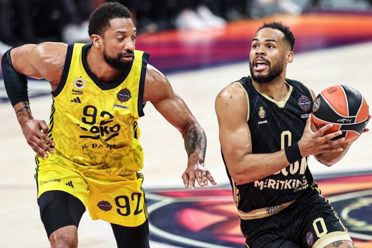 Fenerbahce's Canadian center #92 Khem Birch marks AS Monaco's French guard #0 Elie Okobo during the Euroleague Basketball final match between Fenerbahce Beko Istanbul and AS Monaco at Etihad Arena in Abu Dhabi on May 25, 2025. Fadel SENNA / AFP
