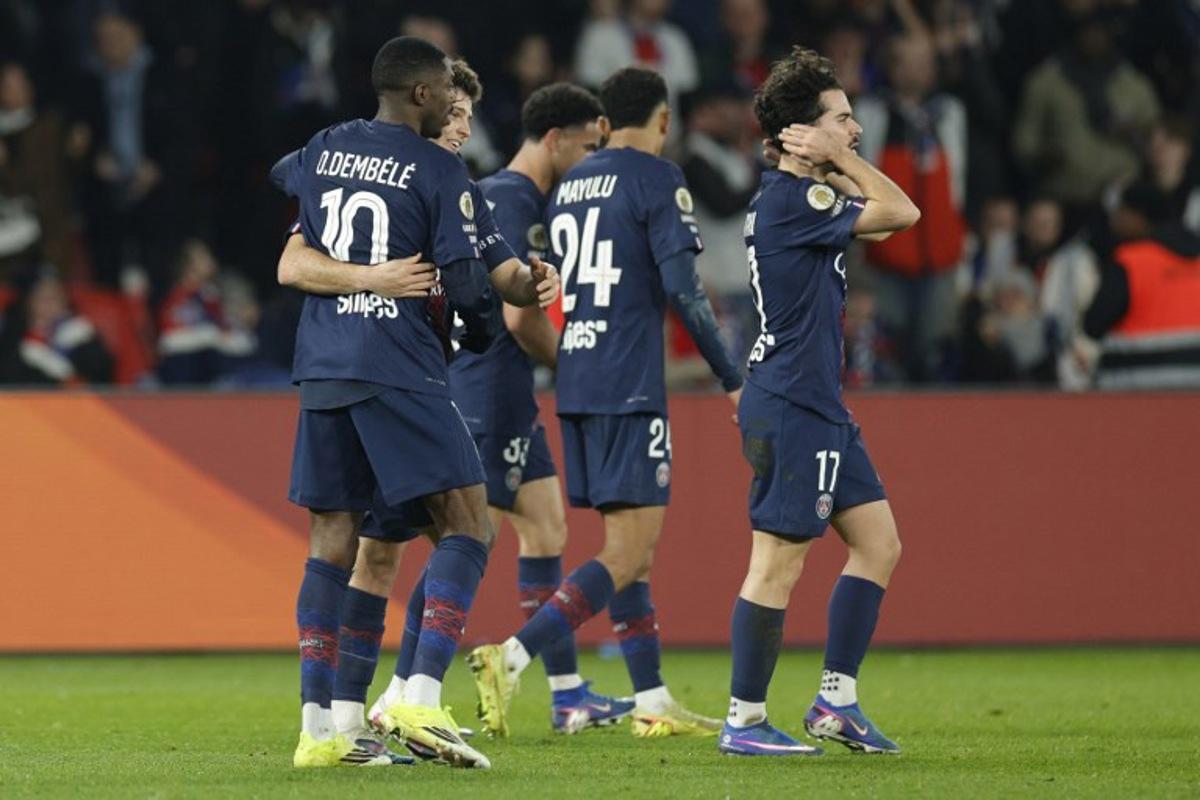 Paris Saint-Germain's French forward #10 Ousmane Dembele (L) celebrates with Paris Saint-Germain's Portuguese midfielder #87 Joao Neves (2L) after scoring Paris Saint-Germain's second goal during the French L1 football match between Paris Saint-Germain (PSG) and Olympique de Marseille (OM) at the Parc des Princes stadium in Paris on February 8, 2026. GEOFFROY VAN DER HASSELT / AFP