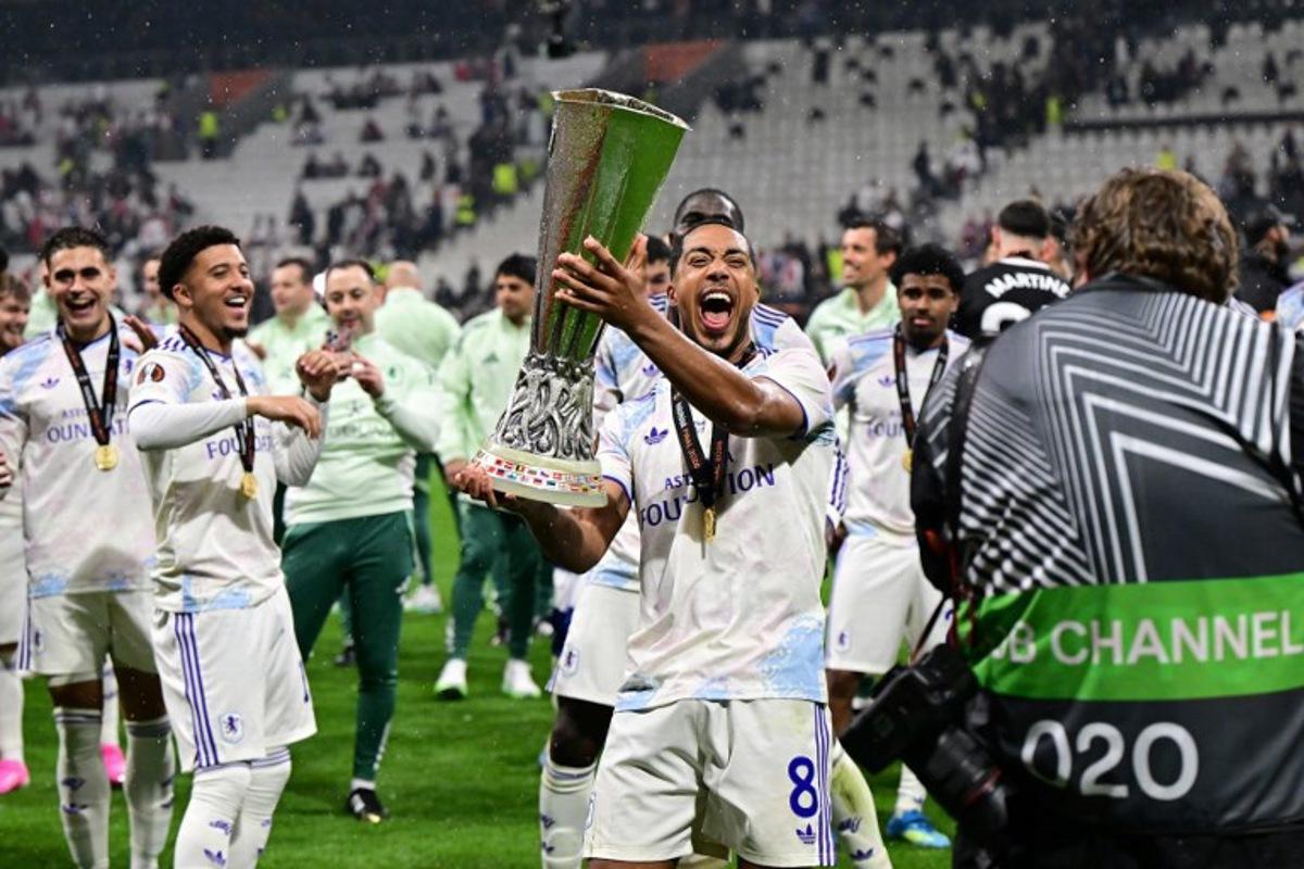 Belgium's midfielder #08 Youri Tielemans celebrates with the trophy after winning the UEFA Europa League final football match between SC Freiburg and Aston Villa at Besiktas Park in Istanbul on May 20, 2026. YASIN AKGUL / AFP