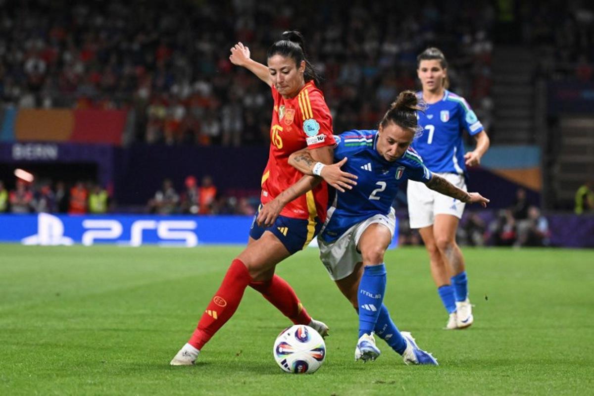 Spain's defender #15 Leila Ouahabi (L) fights for the ball with Italy's defender #02 Elisabetta Oliviero during the UEFA Women's Euro 2025 Group B football match between Italy and Spain at the Wankdorf Stadium in Bern, on July 11, 2025. SEBASTIEN BOZON / AFP