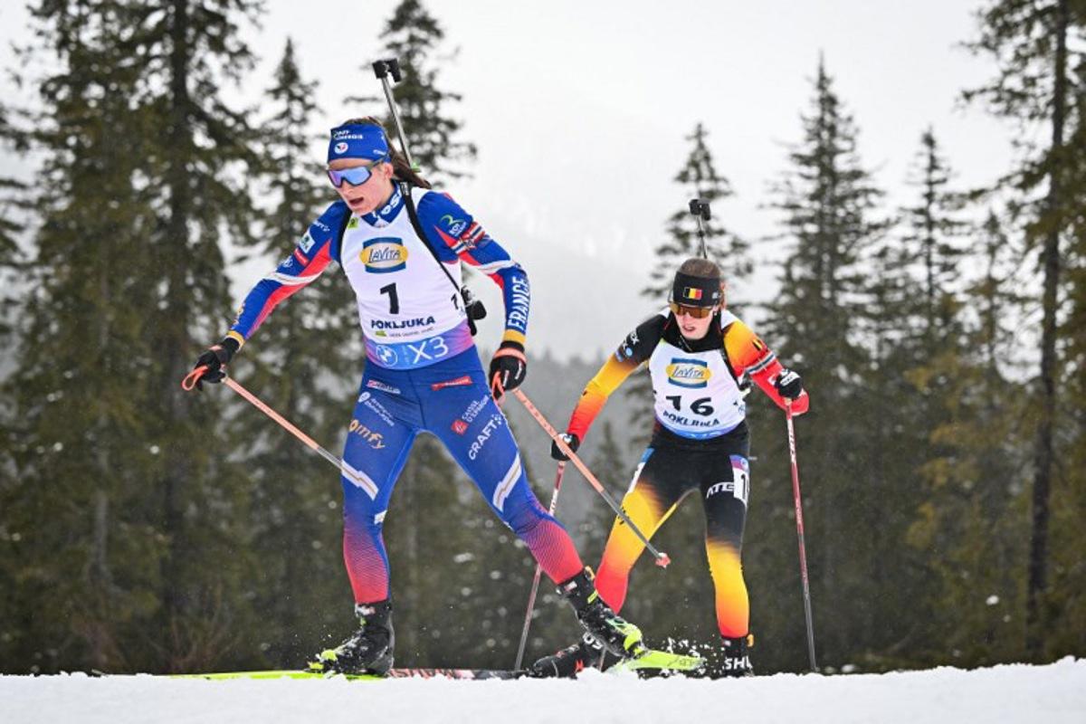 France's Justine Braisaz-Bouchet (L) and Belgium's Eve Bouvard compete during the Women 12.5 km Short Individual competition of the IBU Biathlon World Cup in Pokljuka, Slovenia on March 13, 2025. Jure Makovec / AFP
