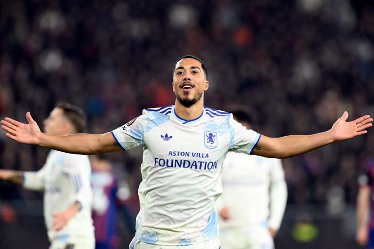 Aston Villa's Belgian midfielder #08 Youri Tielemans celebrates his team's second goal during the UEFA Europa League, league phase, football match between FC Basel and Aston Villa at the St Jakob-Park satdium, in Basel, on December 11, 2025. SEBASTIEN BOZON / AFP