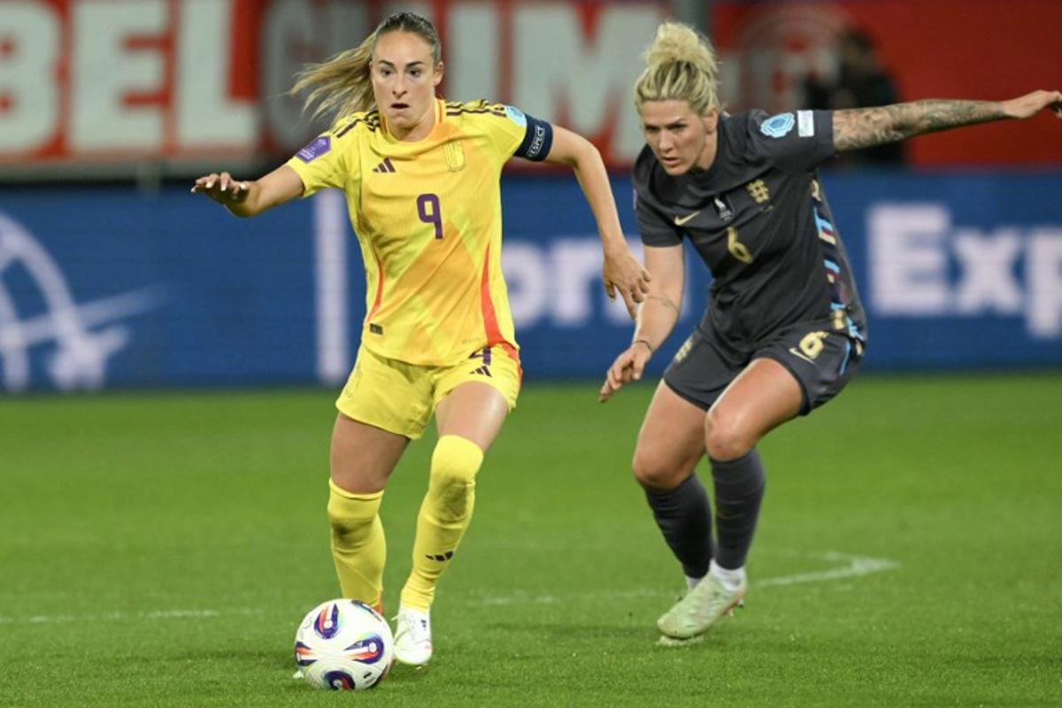 Belgium's forward #09 Tessa Wullaert (L) controls the ball, pursued by England's defender #06 Millie Bright (R) during the UEFA Women's Nations League Group A3 football match between Belgium and England at the Den Dreef stadium in Heverlee, outside Leuven, on April 8, 2025. NICOLAS TUCAT / AFP