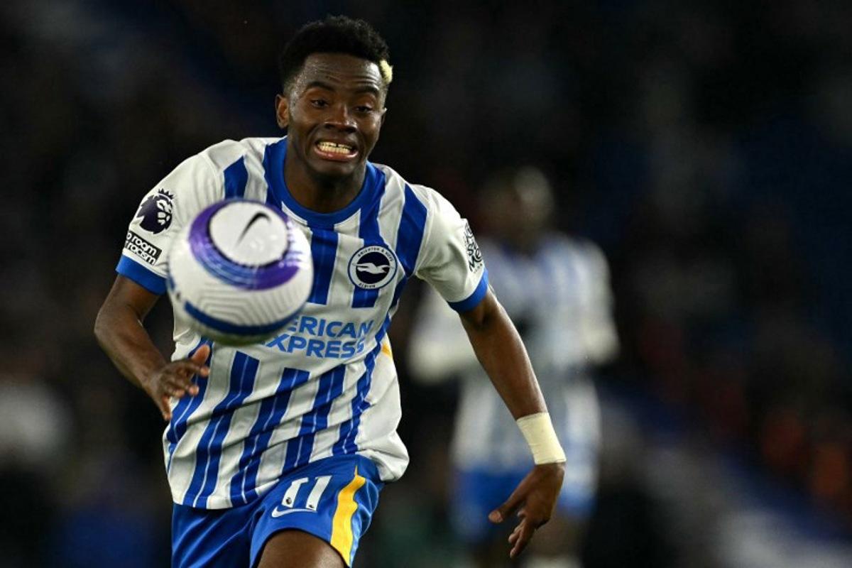 Brighton's Ivorian midfielder #11 Simon Adingra focuses on the ball during the English Premier League football match between Brighton and Hove Albion and Aston Villa at the American Express Community Stadium in Brighton, southern England on April 2, 2025. Glyn KIRK / AFP