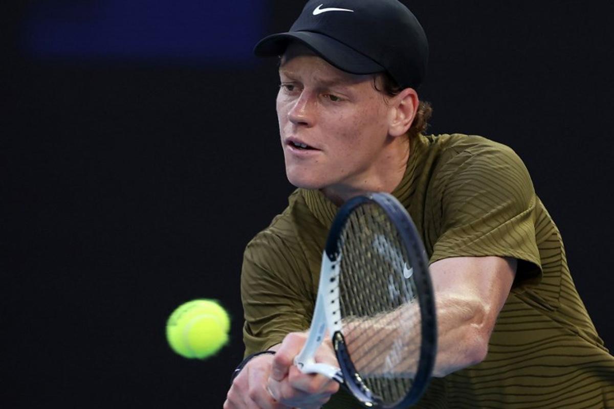 Italy's Jannik Sinner hits a return to France's Hugo Gaston during their men's singles match on day three of the Australian Open tennis tournament in Melbourne on January 20, 2026. Martin KEEP / AFP