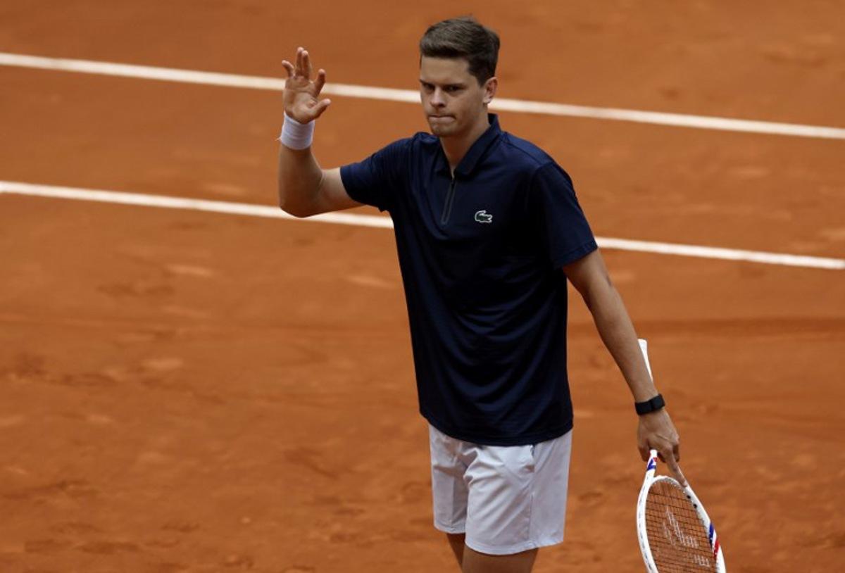 Belgium's Alexander Blockx celebrates after winning the 2026 ATP Tour Madrid Open tennis tournament third round singles tennis match against Canada's Felix Auger-Aliassime at the Caja Magica in Madrid, on April 27, 2026. OSCAR DEL POZO / AFP