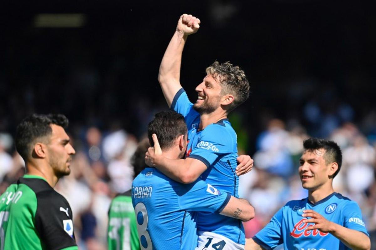 Napoli's Belgian forward Dries Mertens (up) celebrates his goal with teammates during the Italian Serie A football match Napoli vs Sassuolo at Diego Armando Maradona stadium in Naples, on April 30, 2022. Alberto PIZZOLI / AFP