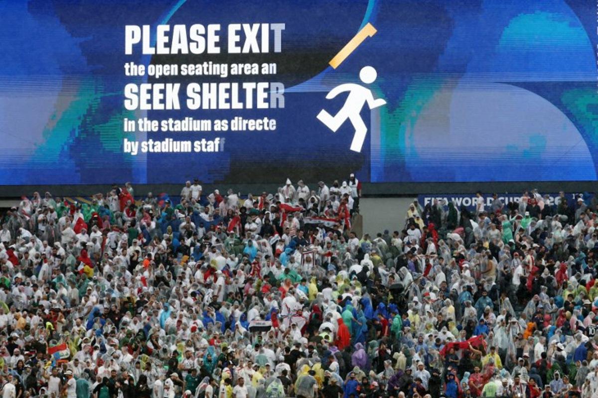 A screen shows an evacuation warning during the 2026 World Cup Group I football match between France and Iraq at the Philadelphia Stadium in Philadelphia on June 22, 2026. FRANCK FIFE / AFP