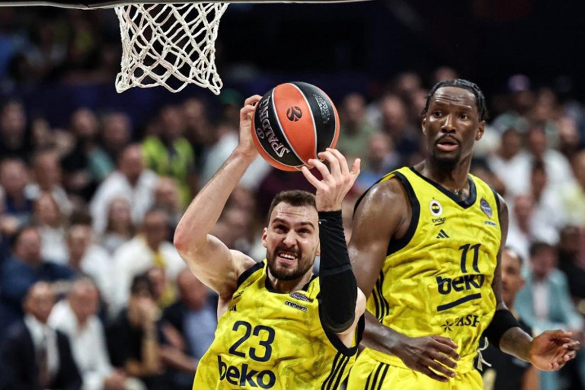 Fenerbahce's Serbian forward #23 Marko Guduric catches the ball during the Euroleague Basketball final match between Fenerbahce Beko Istanbul and AS Monaco at Etihad Arena in Abu Dhabi on May 25, 2025. Fadel SENNA / AFP