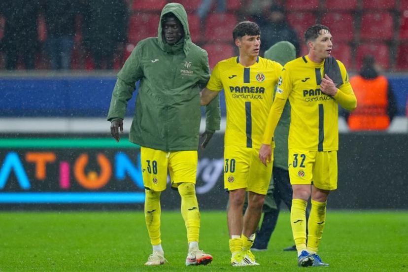 Villarreal's Senegalese midfielder #38 Alassane Diatta, Villarreal's Spanish defender #30 Daniel Budesca and Villarreal's Spanish midfielder #32 Hugo Lopez react at the end of the UEFA Champions League league phase - Day 8 football match between Bayer Leverkusen and Villarreal CF at the BayArena stadium in Leverkusen, western Germany on January 28, 2026. Pau Barrena / AFP