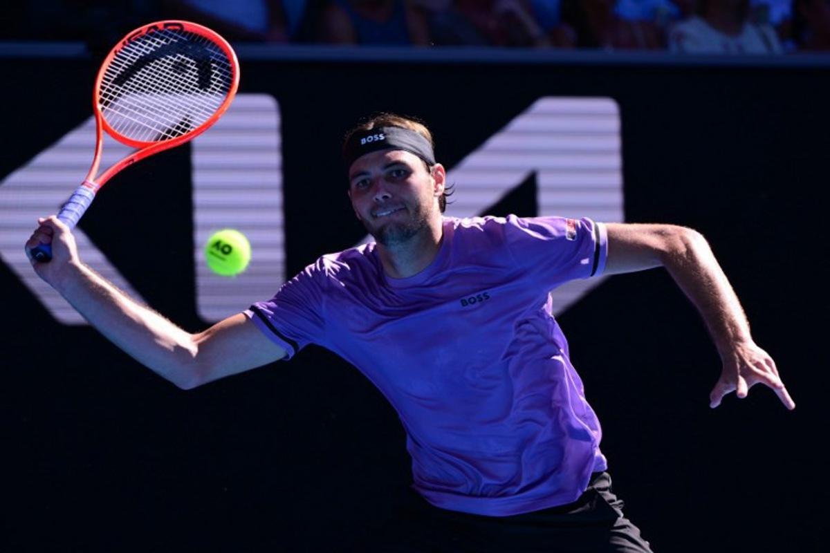 USA's Taylor Fritz hits a shot against France's Gael Monfils during their men's singles match on day seven of the Australian Open tennis tournament in Melbourne on January 18, 2025. Yuichi YAMAZAKI / AFP