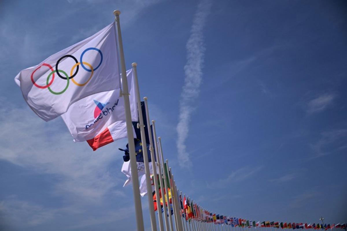 The olympic flag is seen on the Olympic venue for sailing in Marseille, southern France, on July 17, 2024, ahead of Paris 2024 Olympic Games. Christophe SIMON / AFP