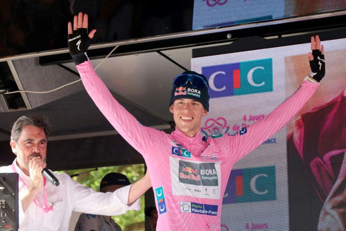 Overall winner Red Bull Bora Hansgrohe's New Zealand's Laurence Pithie celebrates on the podium after the fifth and last stage of the 2026 Four Days of Dunkirk road cycling race, 184km from Saint-Omer to Dunkirk, in Dunkirk, northern France, on May 24, 2026. Francois LO PRESTI / AFP
