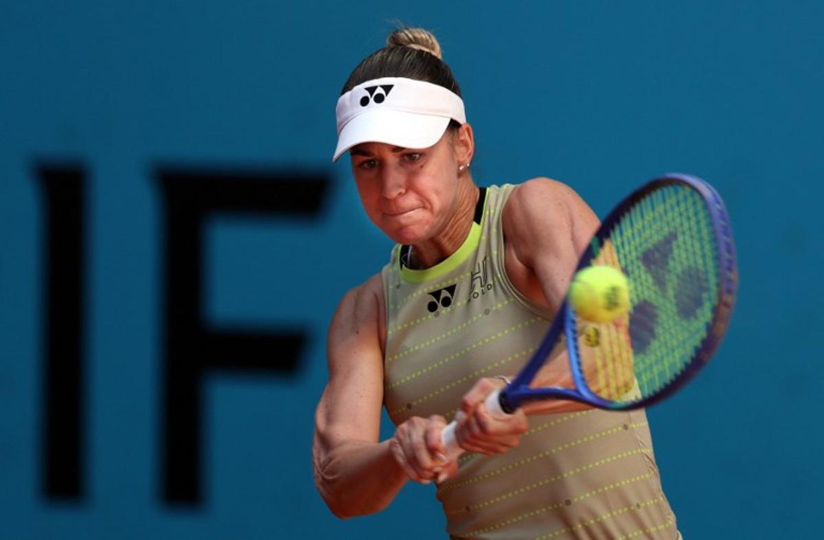 Hungary's Anna Bondar returns the ball to Russia's Mirra Andreeva during their 2026 WTA Tour Madrid Open tennis tournament women's singles match at the Caja Magica in Madrid, on April 27, 2026. Thomas COEX / AFP