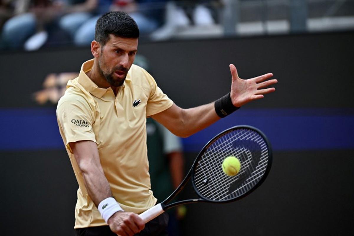 Serbia's Novak Djokovic plays a backhand return to Croatia's Dino Prizmic during their men's singles match of the WTA Rome Open tennis tournament at the Foro Italico in Rome on May 8, 2026. Filippo MONTEFORTE / AFP