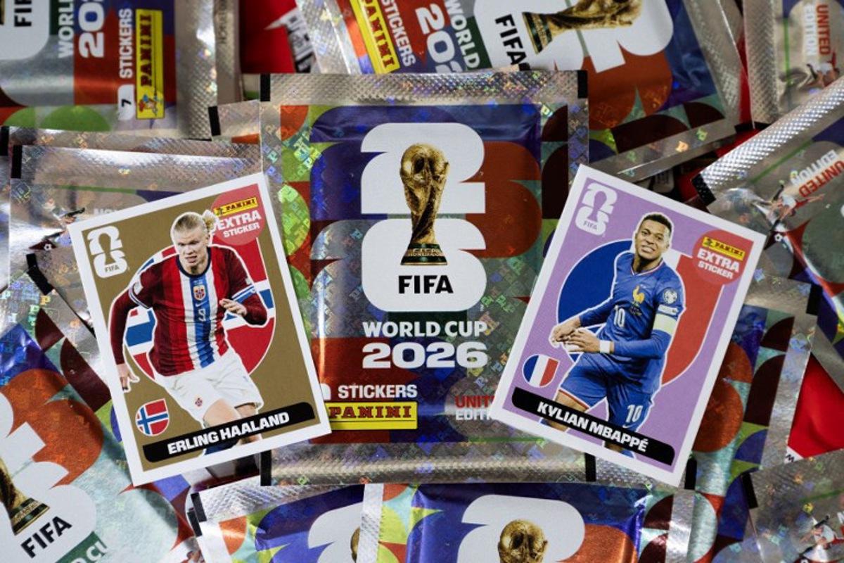 Collectible cards for the upcoming 2026 FIFA World Cup hosted by the US, Canada and Mexico, of Norway's forward Erling Haaland (L) and France's forward Kylian Mbappe, are displayed with packets at the Panini Group factory in Modena, northern Italy, on April 28, 2026. The Panini Group holds the exclusive rights for the official collectible cards and stickers for the 2026 FIFA World Cup hosted by the US, Canada, and Mexico. MARCO BERTORELLO / AFP